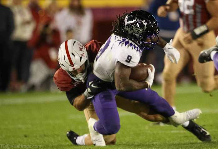 TCU running back Emani Bailey carries the ball against Iowa State